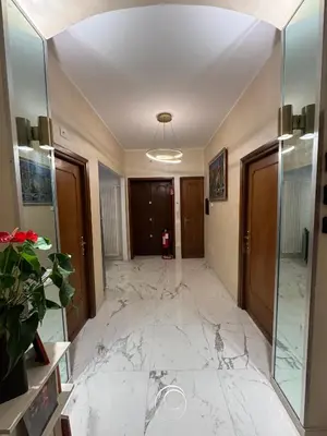 a hallway with marble flooring in a building at Suite 41 in Rome