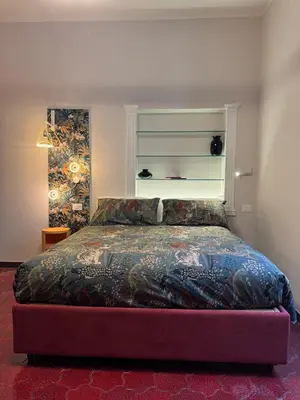 a bedroom with a bed in a room at Suite 41 in Rome