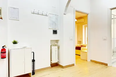 a room with a radiator and a room with a bed at Roma Passion Suite in Rome