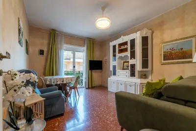 a living room with a couch and a table at GuestHost - La Rosa di Trastevere in Rome