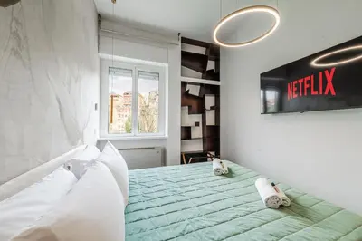 a bedroom with a bed with two stuffed animals on it at Rome Centre - Spacious Apartment - AC - Wi-Fi - Metro in Rome