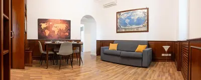 a room with a table and a chair and a desk at Suite Vaticano in Rome