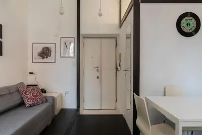 a living room with a couch and a table at GuestHost - Cozy Apartment near Tiburtina in Rome