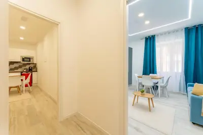 a large mirror in a room with a living room at Jhonny's Apartment Near Vatican 3 bedroom's in Rome