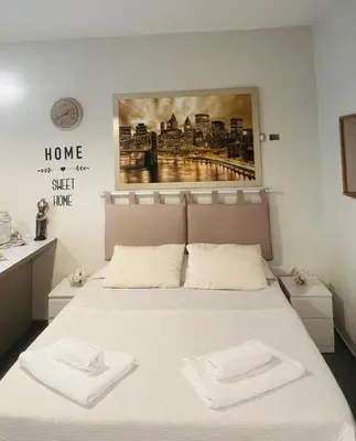 a bedroom with a bed with two towels on it at Guest house Aria in Rome