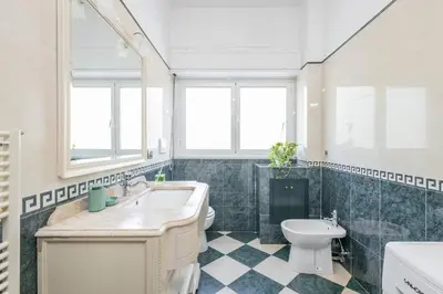 a bathroom with a sink and a toilet at Green Home Caravaggio in Rome