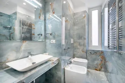 a bathroom with a sink and a toilet at Eternal House Caulonia in Rome