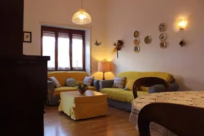 a living room with a couch and a table at casa vacanze Borgo San Lazzaro in Rome
