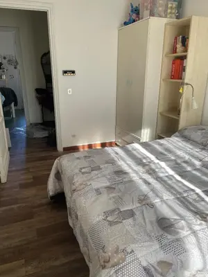 a bedroom with a bed and a book shelf at Sunny apartment in central Rome in Rome