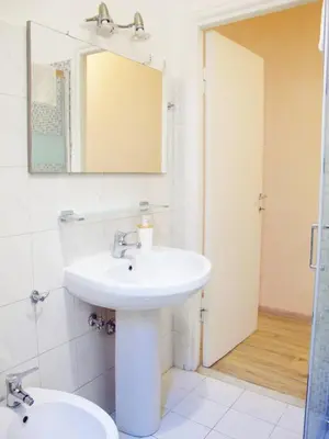 a bathroom with a sink and a mirror at Blue House Termini-Colosseo in Rome