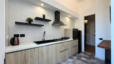 a kitchen with a sink and a stove at Casa Daria in Rome