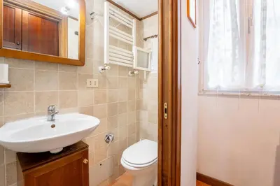 a bathroom with a sink and a toilet at Domus Leopardo, Typical Trastevere Flat in Center in Rome