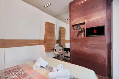 a hotel room with a bed with towels on it at NEW 3BDR Lab4House a Villa Borghese Roma Parioli in Rome