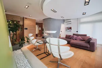 a living room with a couch and a table and chairs at NEW 3BDR Lab4House a Villa Borghese Roma Parioli in Rome