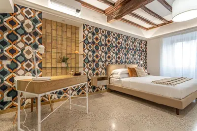 a bedroom with a bed and a desk at Key Apartment Trastevere in Rome