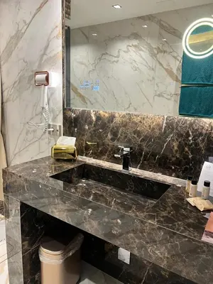 a bathroom with a marble sink and a mirror at SOFIA Ultra Suite Collection in Rome