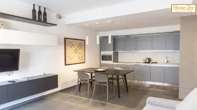 a kitchen and dining room with a table and chairs at House - Via Boccea - Too in Rome