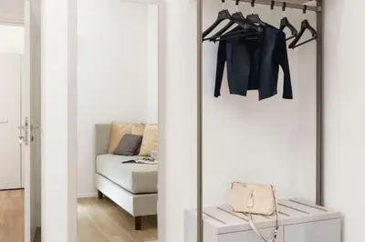 a room with a sliding door with a closet at St Peter Museum in Rome