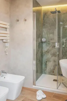 a bathroom with a shower and a sink at St Peter Museum in Rome
