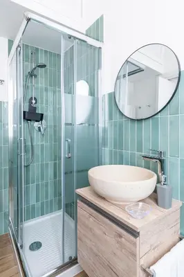 a bathroom with a sink and a shower at Vatican Cozy Studio in Rome