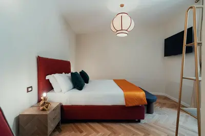a bedroom with a bed and a ladder in it at Casa mia Navona Rooms in Rome