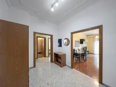 a living room with a table and a dining room at Welcome to Pigneto in Rome