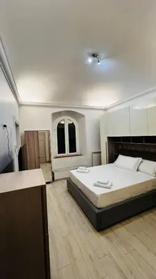 a bedroom with a large bed in a room at My house in Rome