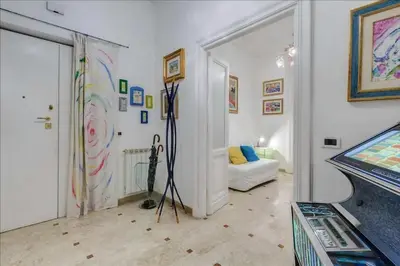 a living room with a room with a video game at Holiday Jeans Apartment in Rome