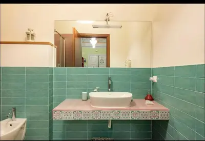 a bathroom with a sink and a mirror at The Bright Marajà Roma Centro Luxury Boutique Retreat in Rome