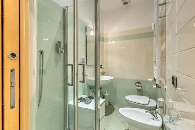 a bathroom with a sink and a toilet and a shower at VaticanRhome I in Rome