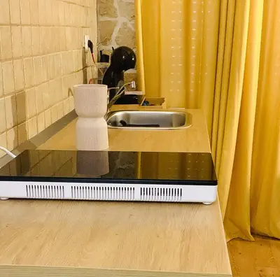 a bathroom with a sink and a scale on the floor at ZAIRA ROMA HOUSE, alloggio per uso turistico in Rome