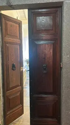 two wooden doors are next to each other at Colosseo Promenade in Rome