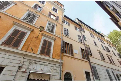a large building with many windows on a street at The Father s House in Rome