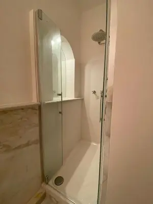 a shower with a glass door in a bathroom at Ripa di Trastevere in Rome