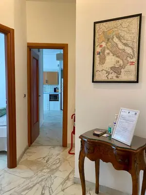 a room with a table and a map on the wall at Ripa di Trastevere in Rome