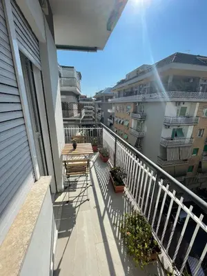 a balcony of a building with chairs and plants at Casa cozy e luminosa - Tiburtina in Rome