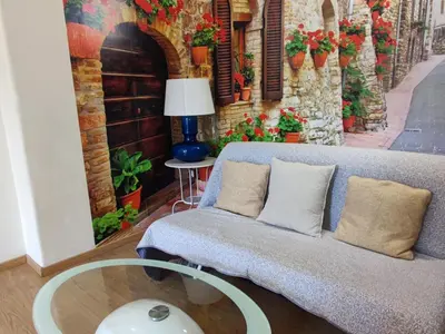a living room with a couch and a table at Azzurra Home in Rome