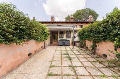 an exterior view of a house with a courtyard at Suede Loft Retreat, Charm, Relax Private Parking in Rome