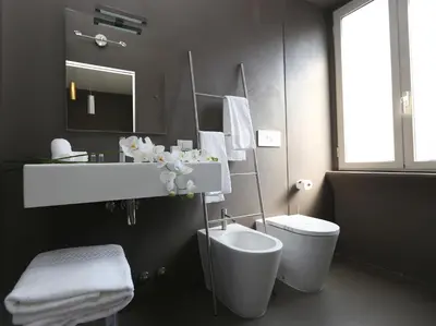 a bathroom with a white sink and a toilet at Residenza Crescenzio in Rome