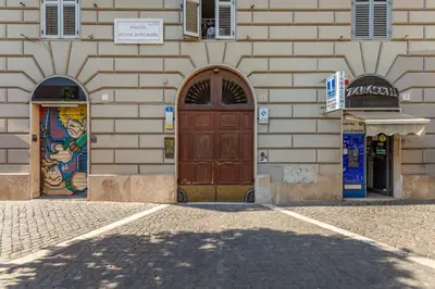 a building with two doors on the side of it at Easybnb - Daisy in Rome
