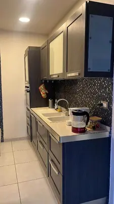 a kitchen with a sink and a refrigerator at Pantheon Luxury Apartment in Rome