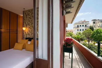 a bedroom with a bed on a balcony at Orange Tree Home in Rome