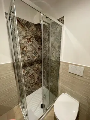 a bathroom with a shower and a toilet at Casa Amicitia Piazza di Spagna in Rome