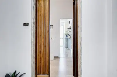 a hallway with a large mirror in a room at L'oasi romana di Daniela in Rome