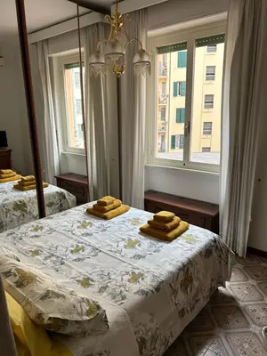a bedroom with two beds with towels on them at A casa di Tony in Rome
