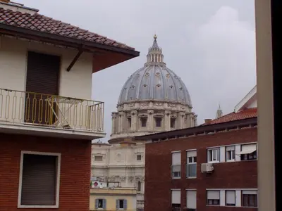 a domed building with a cathedral in the background at Apartment in the center of Rome with spectacular view of the Dome in Rome