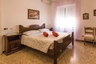 a bedroom with a bed with two stuffed animals on it at Apartment in the center of Rome with spectacular view of the Dome in Rome