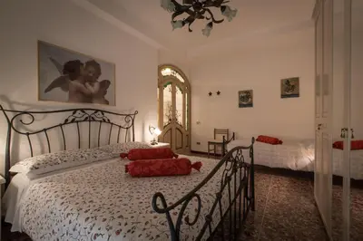 a bedroom with a bed with red pillows on it at Apartment in the center of Rome with spectacular view of the Dome in Rome