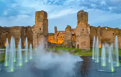 a group of fountains in front of a castle at Metronia Maison in Rome