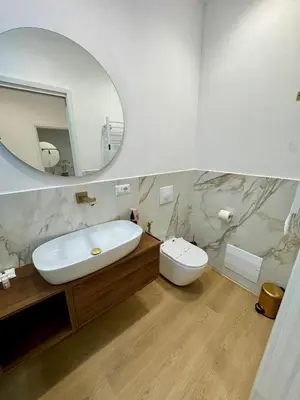 a bathroom with a sink and a toilet and a mirror at Scala 37 interno 2, Trastevere, Rome in Rome